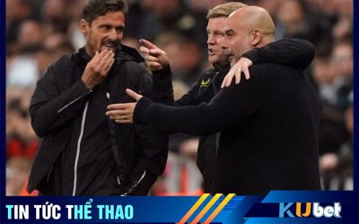 Kubet cập nhật hình ảnh HLV Pep Guardiola (mặc áo len) đang ôm và trò chuyện với HLV Newcastle ông Eddie Howe trong một trận đấu của 2 CLB